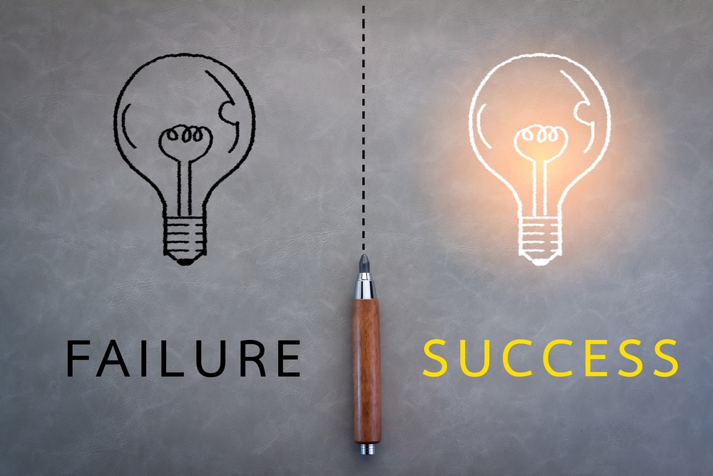 two lightbulb graphics with text "failure" and "success"