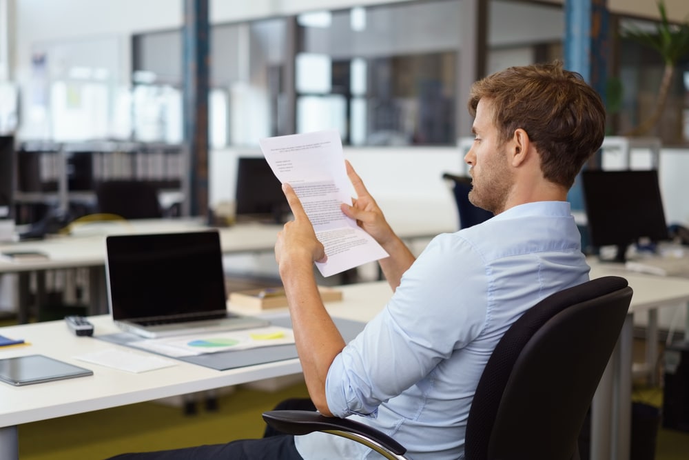 person reading office document