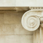 Decorative detail of an ancient Ionic column. close up.