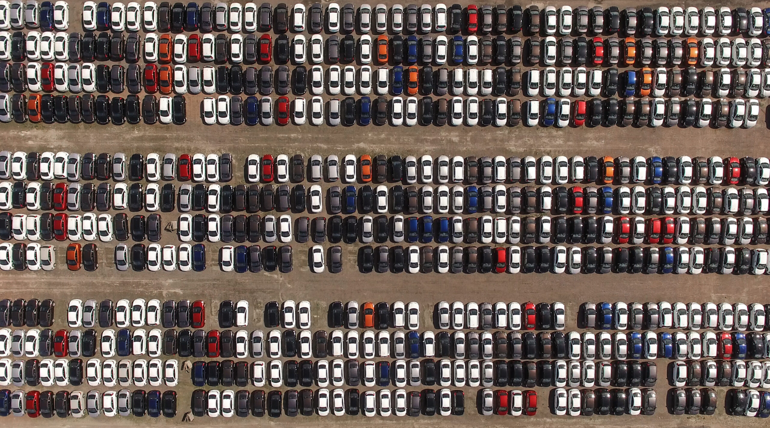 aerial view of parking lot full of cars