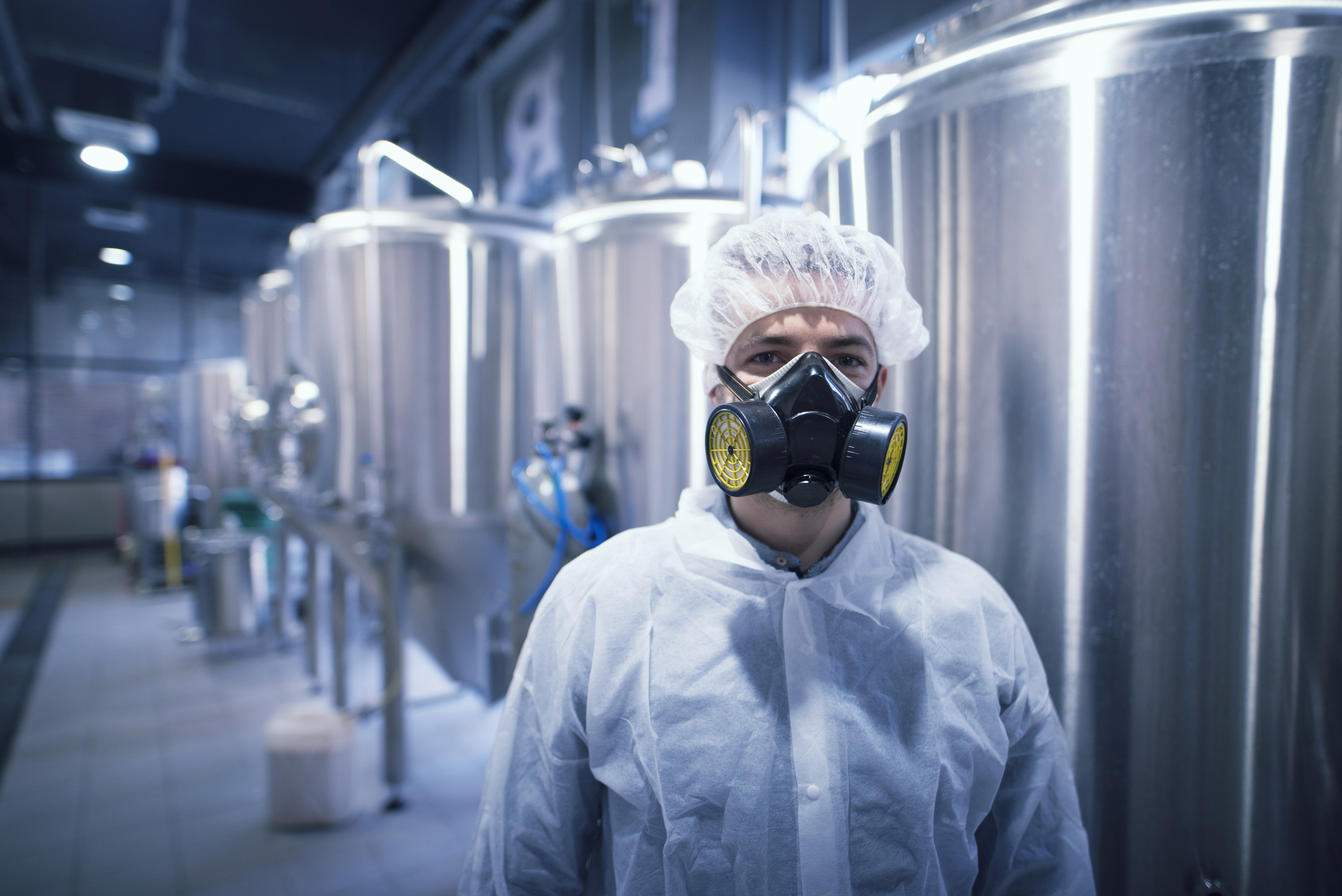 Industrial plant worker wearing mask