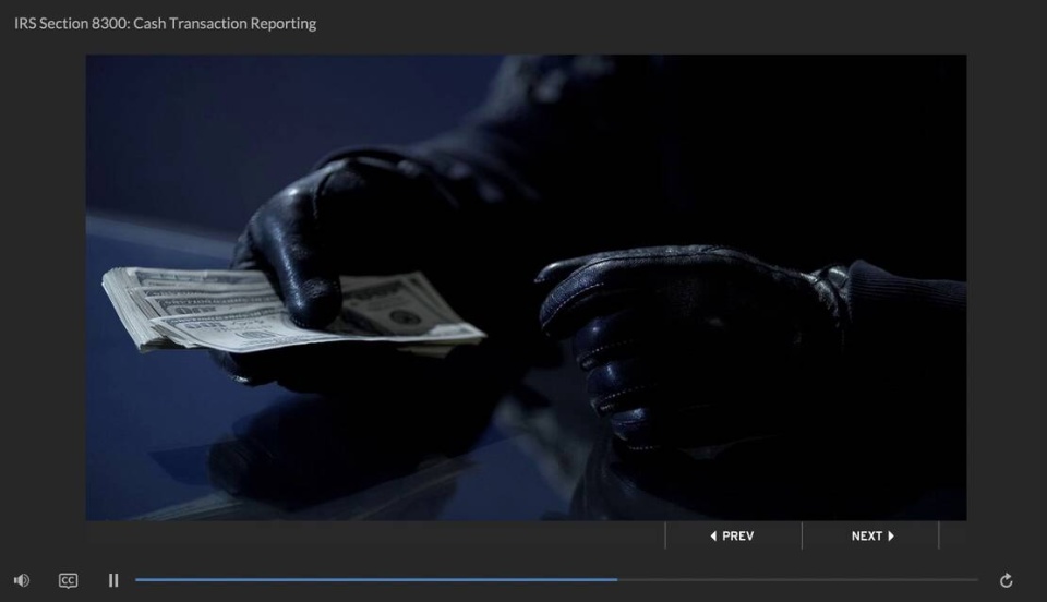 person with gloves and hundred dollar bills