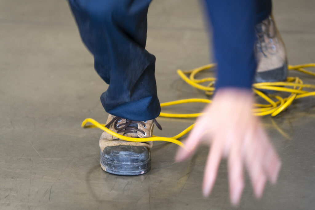 Worker trips over an electrical cord